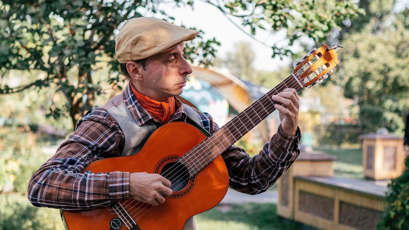A flamenco guitarist playing on stage